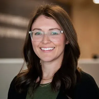 Meghan Craven- caucasian woman with brown hair and glasses