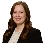 JoAnna Ness, a woman wearing a purple shirt and black jacket