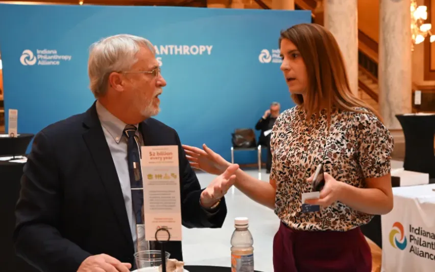IPA member conversing at Day at the Statehouse