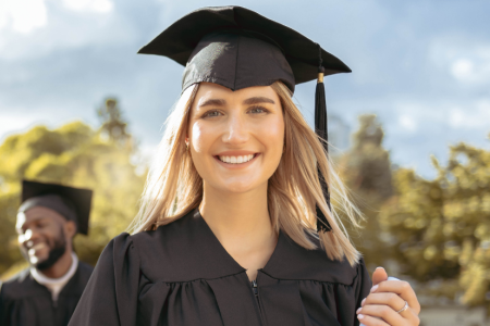 new graduates in their cap and gowns