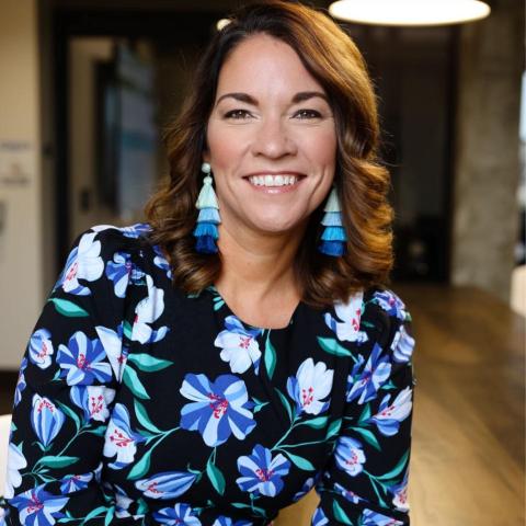 Jennifer Bartenbach, a woman with a blue floral top
