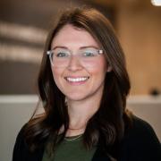 Meghan Craven, caucasian woman with brown hair and glasses